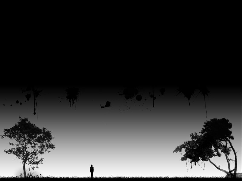 Silhouette of a person in a dark landscape