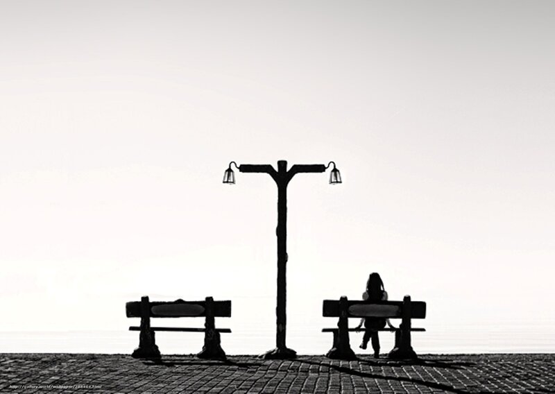 Silhouette of a person on a bench