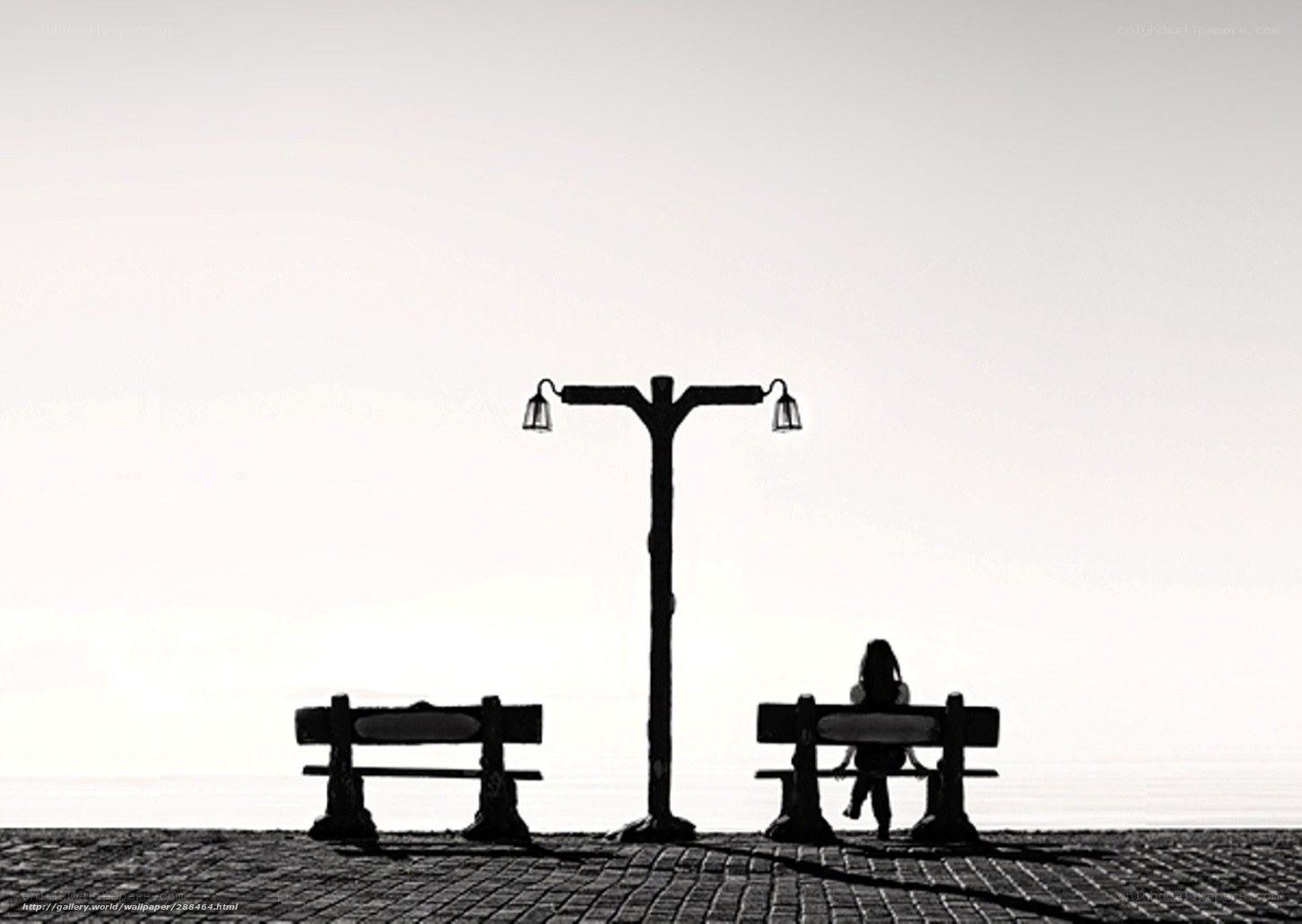 Silhouette of a person on a bench