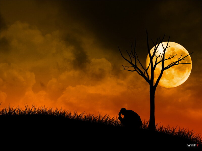Silhouette of a person under a full moon