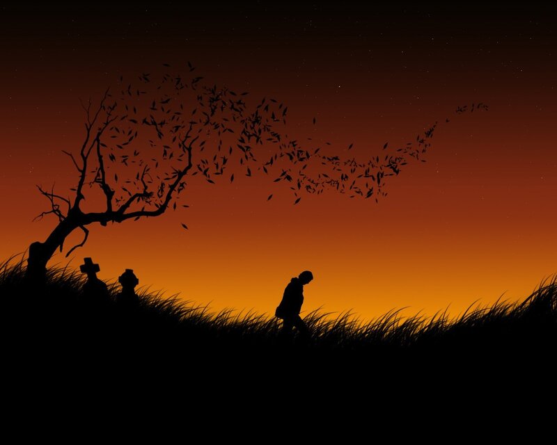 Silhouette of a person walking at dusk