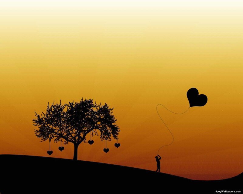 Silhouette of a person with heart balloon