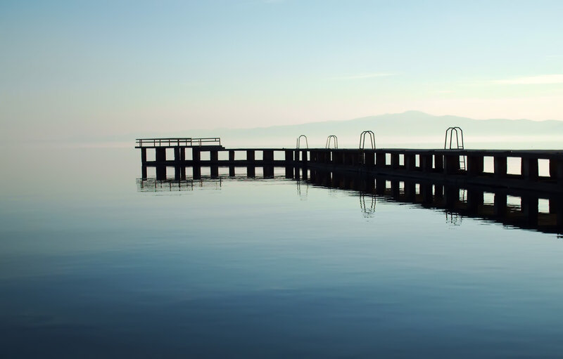Silhouette of a pier at dawn
