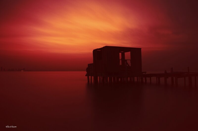 Silhouette of a Pier at Sunset