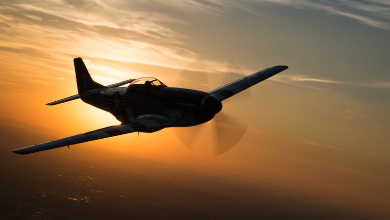 Silhouette of a Propeller Plane — Orange