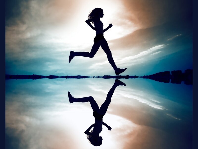 Silhouette of a runner at sunset