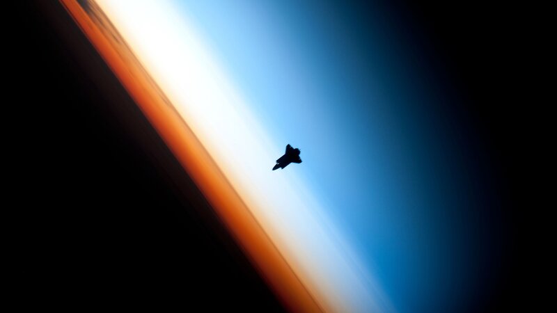 Silhouette of a spacecraft in orbit