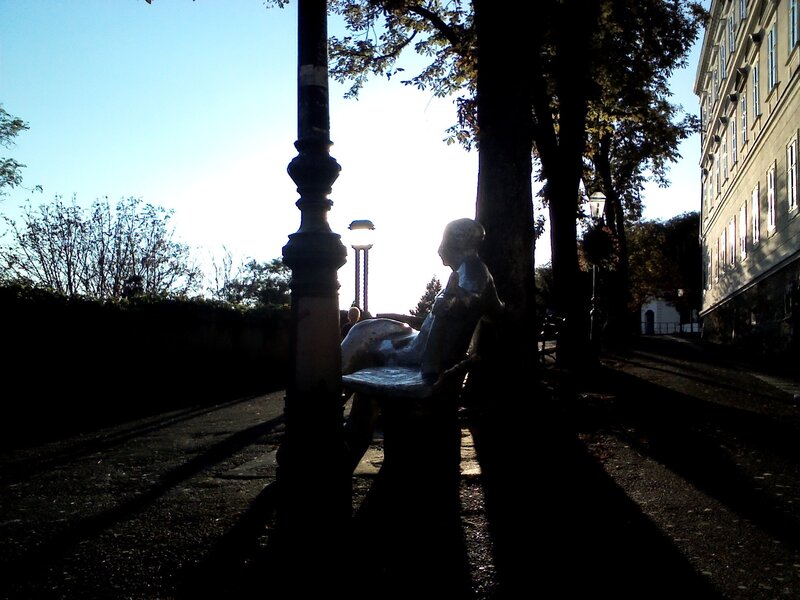Silhouette of a statue in a park