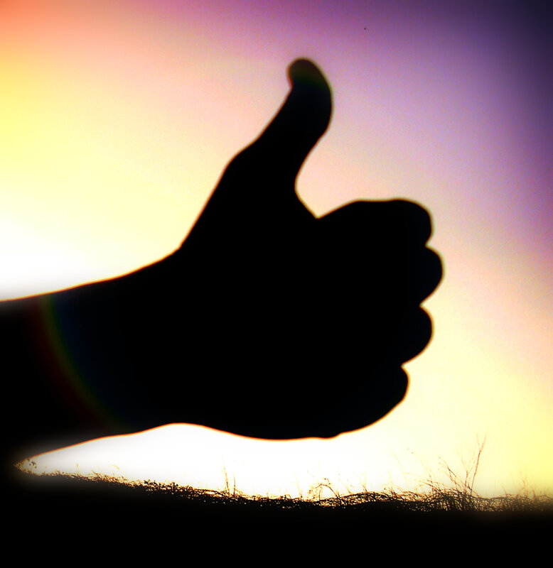 silhouette of a thumbs-up gesture