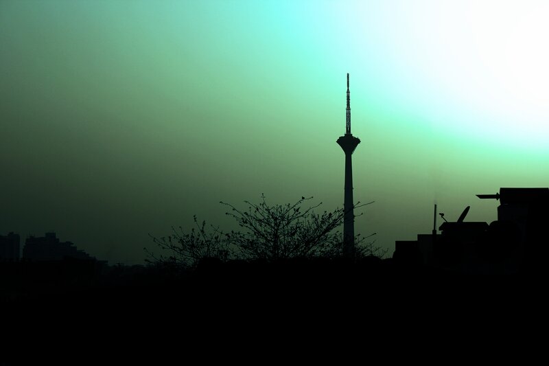 silhouette of a tower at dawn