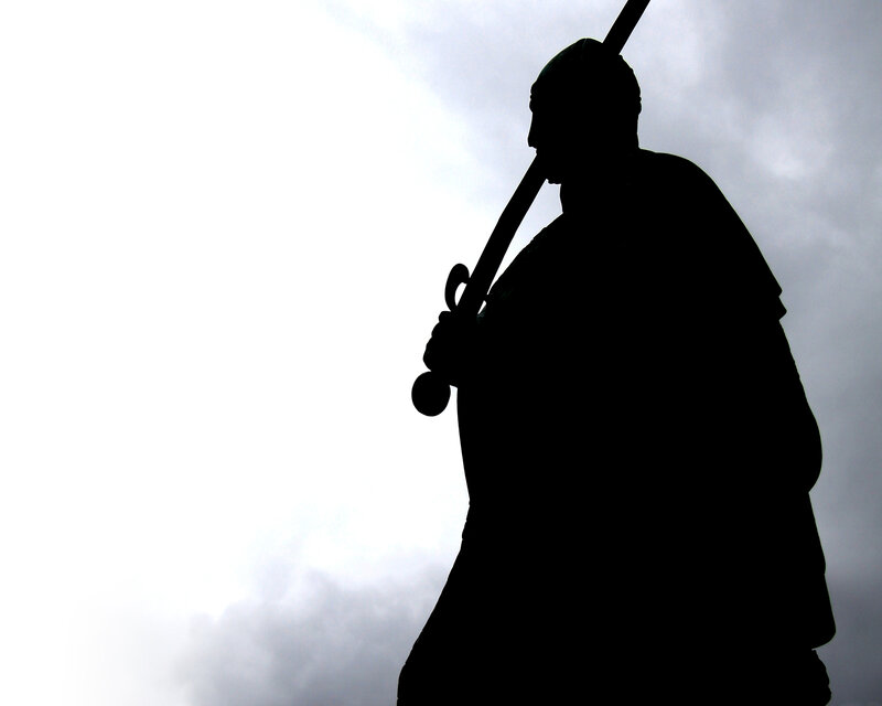silhouette of a warrior statue