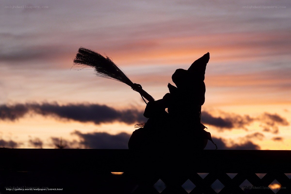 silhouette of a witch at sunset