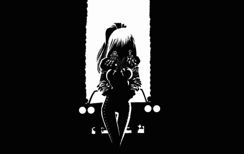 silhouette of a woman in a car