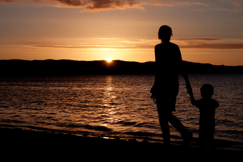 Silhouette of Adult and Child — Orange