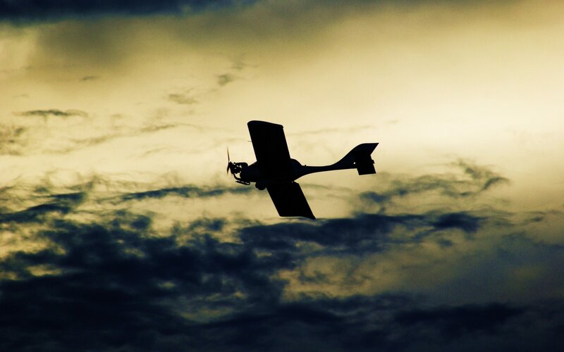 silhouette of airplane in sky