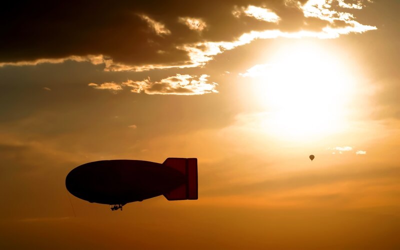 Silhouette of Airship — Orange, Dramatic