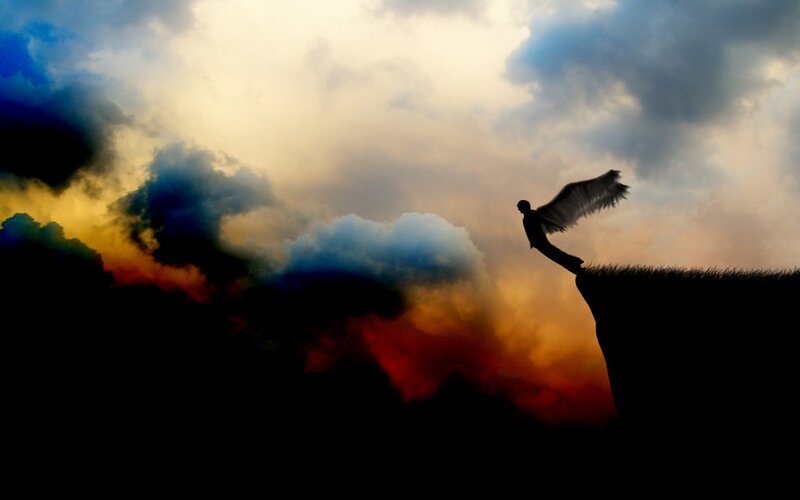 Silhouette of Angel on Cliff