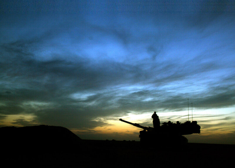 Silhouette of artillery at dusk