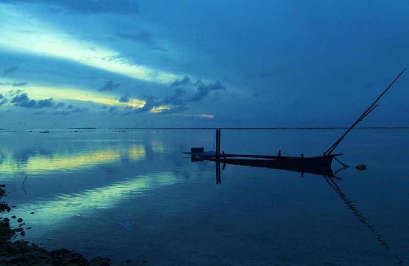 Silhouette of boat at dusk