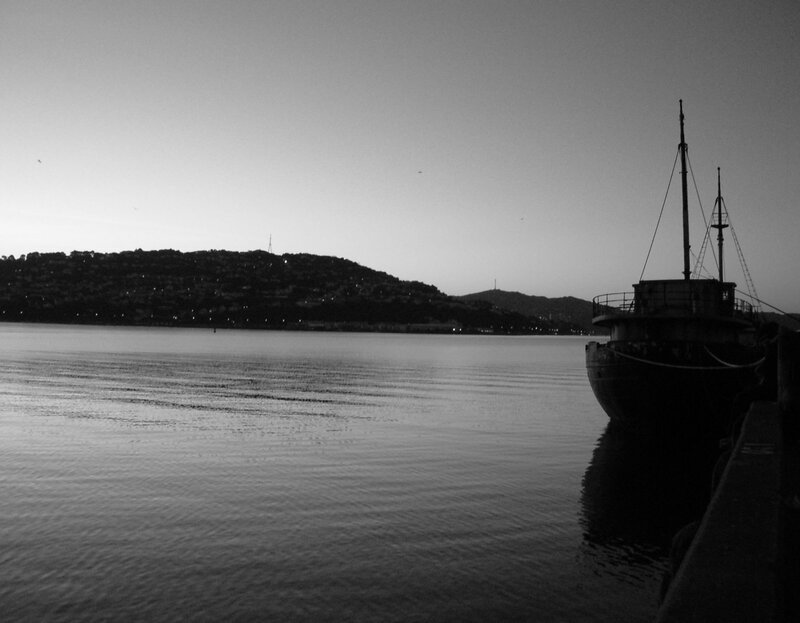 silhouette of boat at dusk