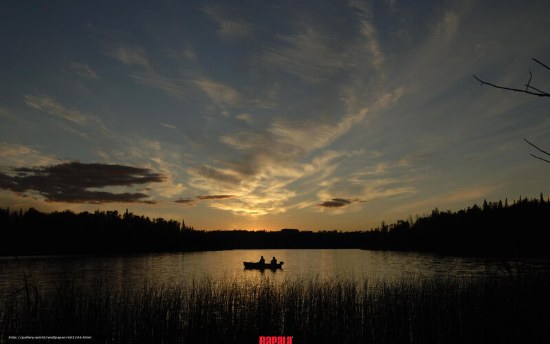 Silhouette of boat at sunset
