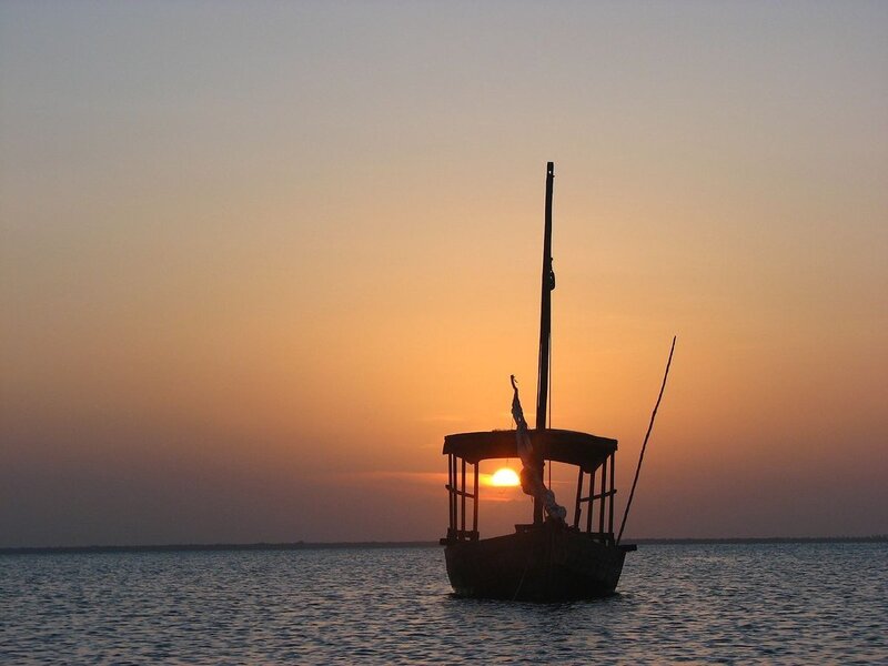 Silhouette of Boat at Sunset — Orange