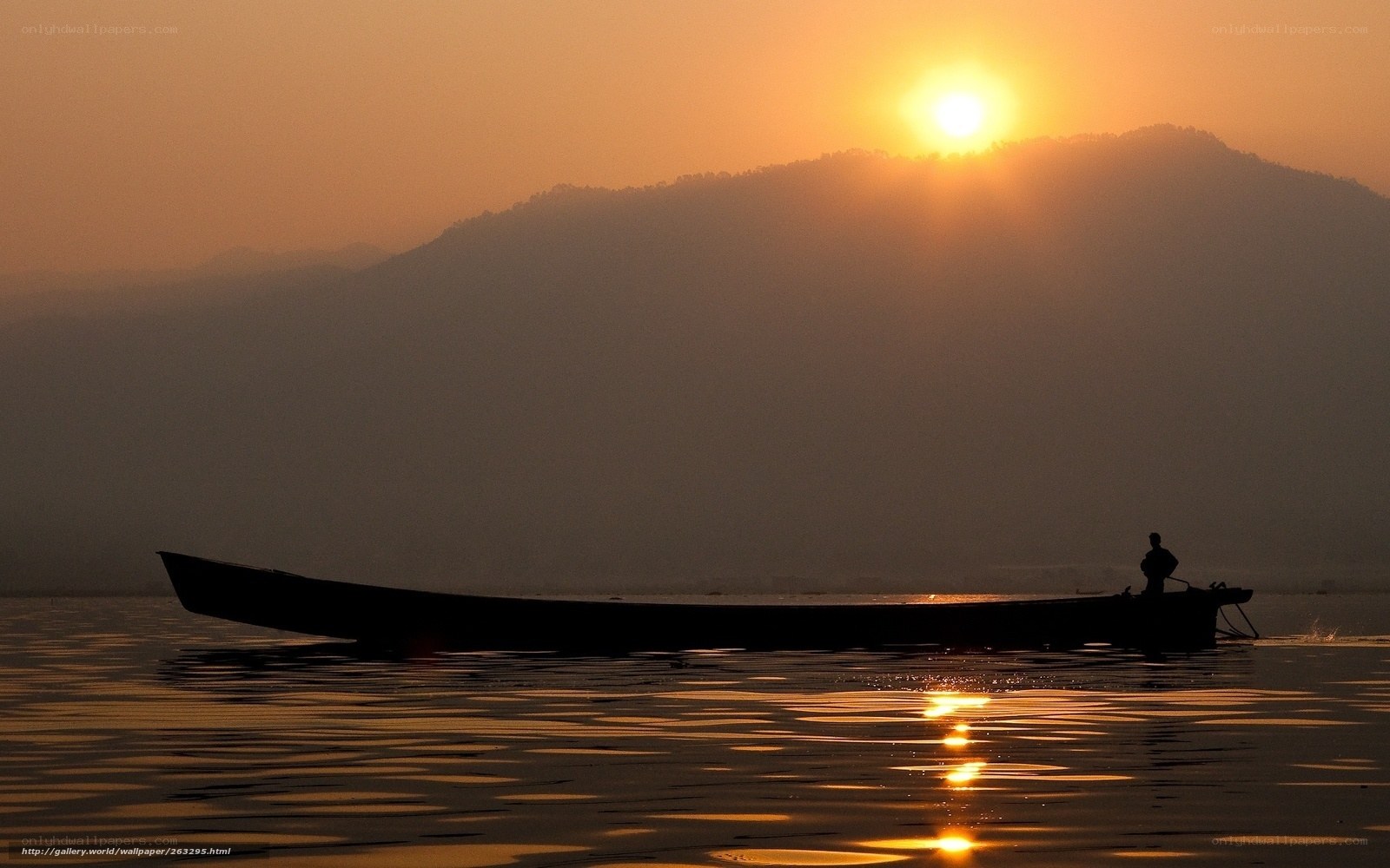 Silhouette of boat at sunset