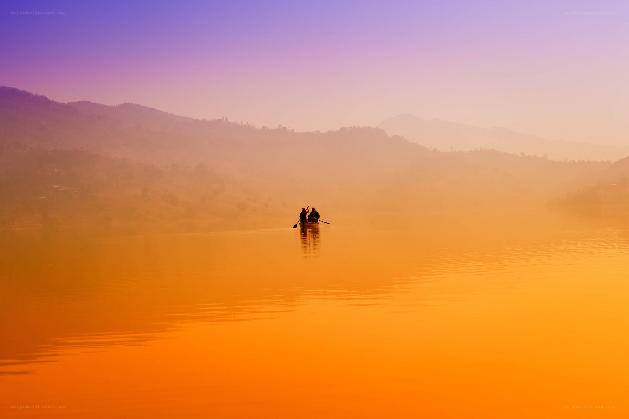 Silhouette of boat on calm lake