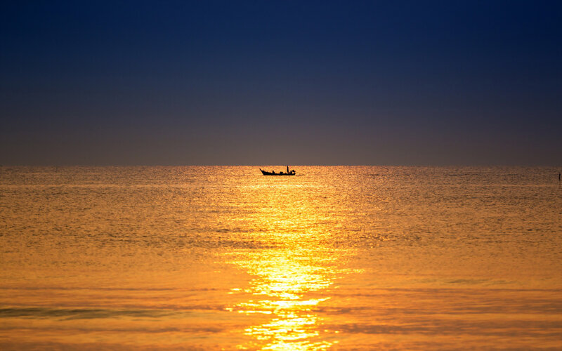 Silhouette of Boat on Water — Gold, Serene, Sunset