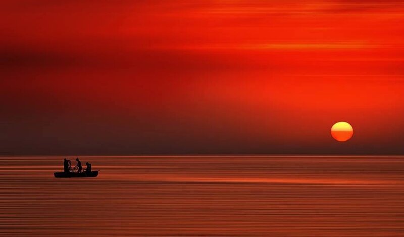 Silhouette of Boat on Water — Red, Dramatic, Sunset