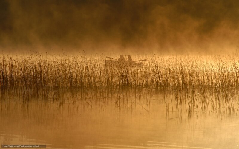 Silhouette of boaters in mist