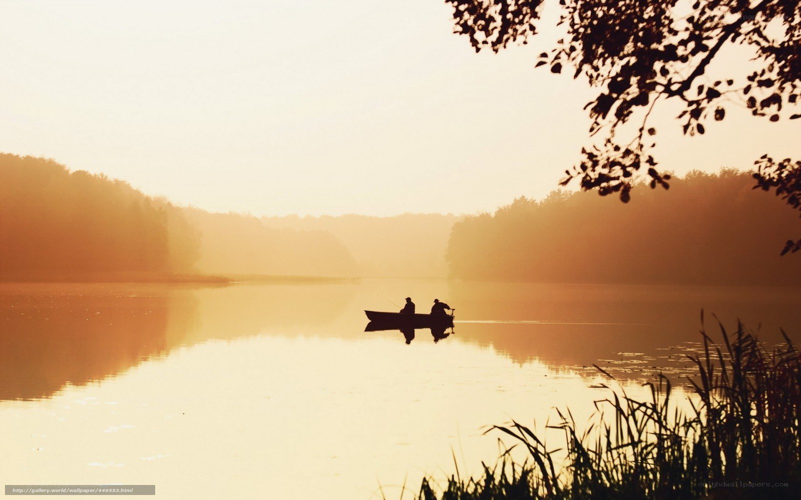 Silhouette of boaters on a lake