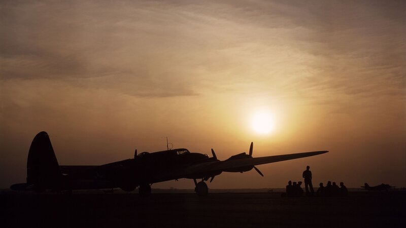 Silhouette of Bomber Plane — Orange, Dramatic, Sunset