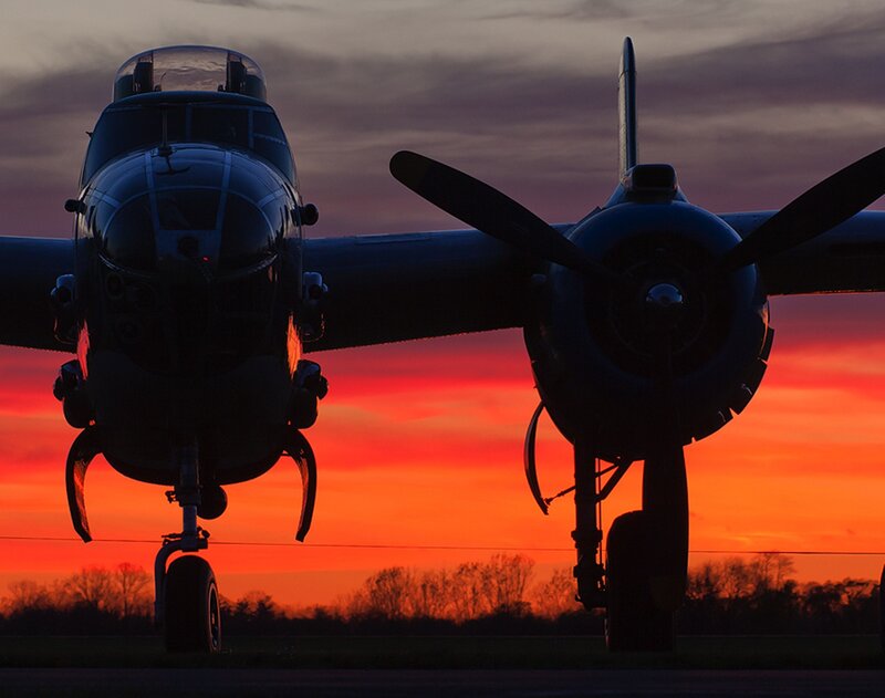 Silhouette of Bomber Plane — Orange, Dramatic