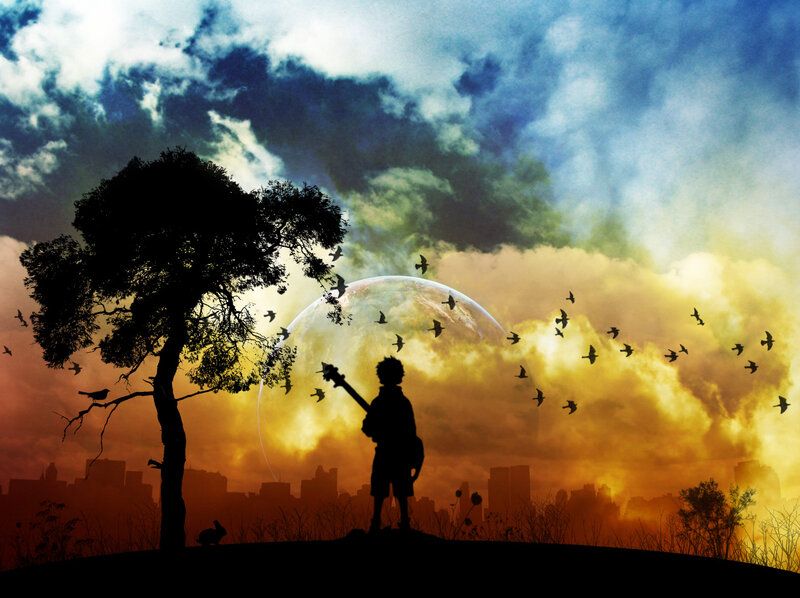 Silhouette of boy with guitar
