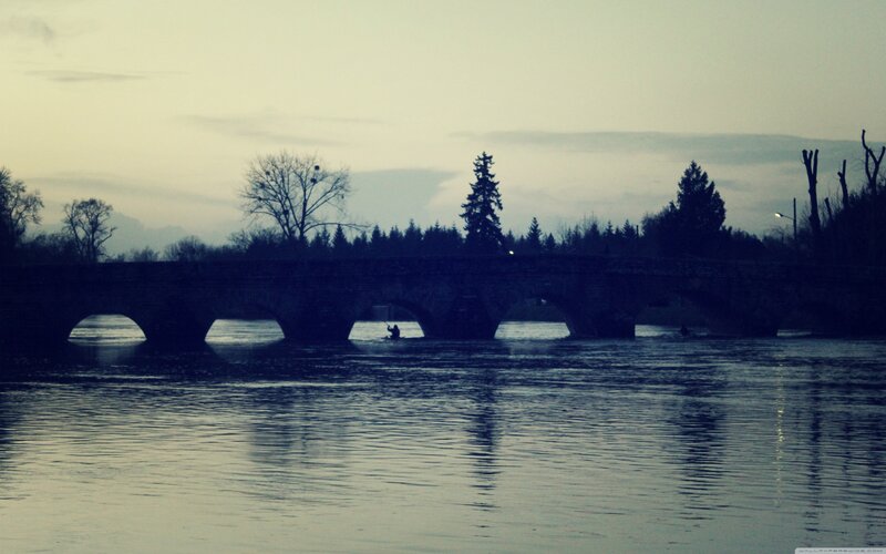 Silhouette of bridge at dusk