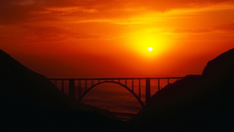 Silhouette of Bridge at Sunset — Orange, Dramatic, Photograph, Mountain, Sun