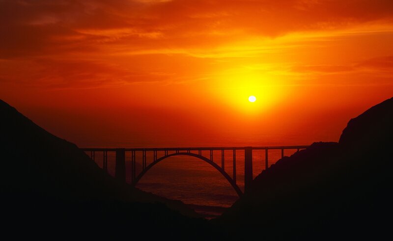 Silhouette of Bridge at Sunset — Orange, Dramatic, Photograph, Sun, Mountains