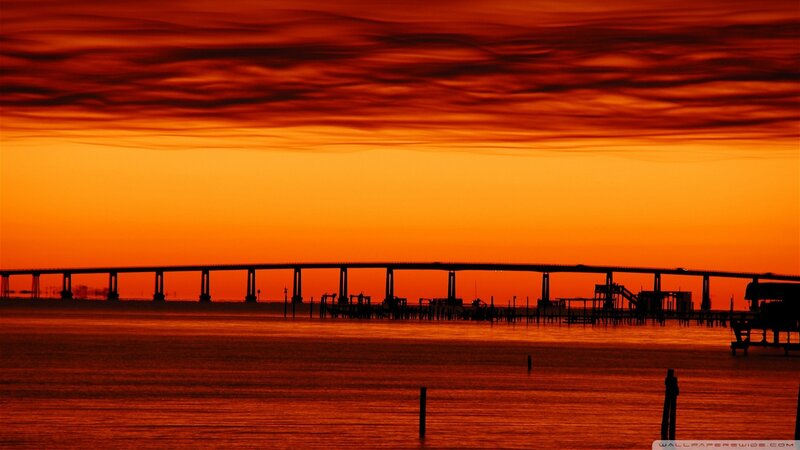 Silhouette of Bridge at Sunset — Orange, Dramatic, Photograph, Water