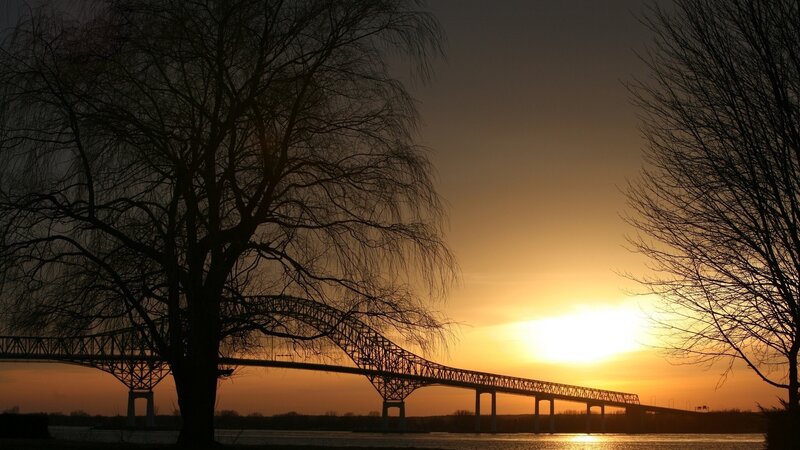 Silhouette of Bridge at Sunset — Orange, Serene, Photograph, Tree, River