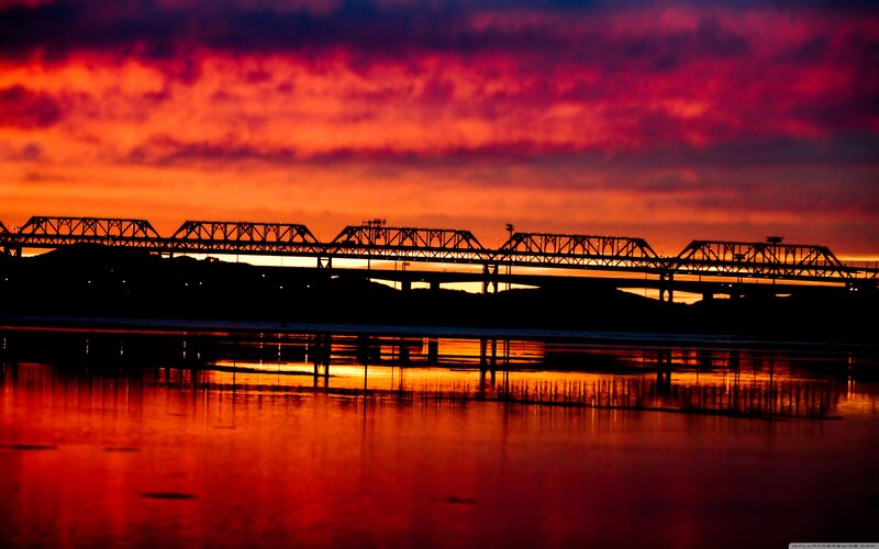 Silhouette of Bridge at Sunset — Red, Dramatic