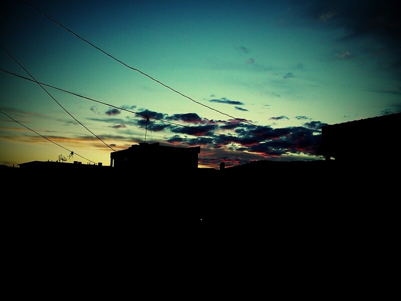 silhouette of buildings at sunset