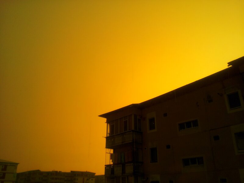 silhouette of buildings at sunset