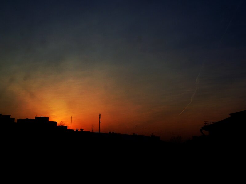 silhouette of buildings at sunset