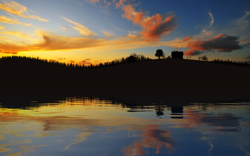 Silhouette of Cabin on Hill