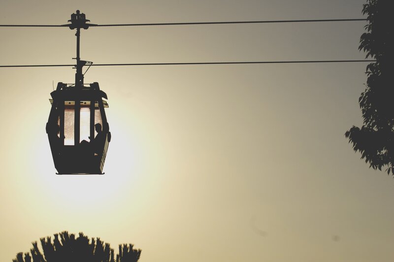 Silhouette of cable car at sunset