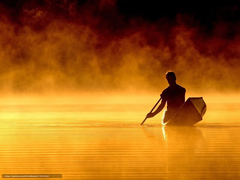 Silhouette of Canoeist at Dawn