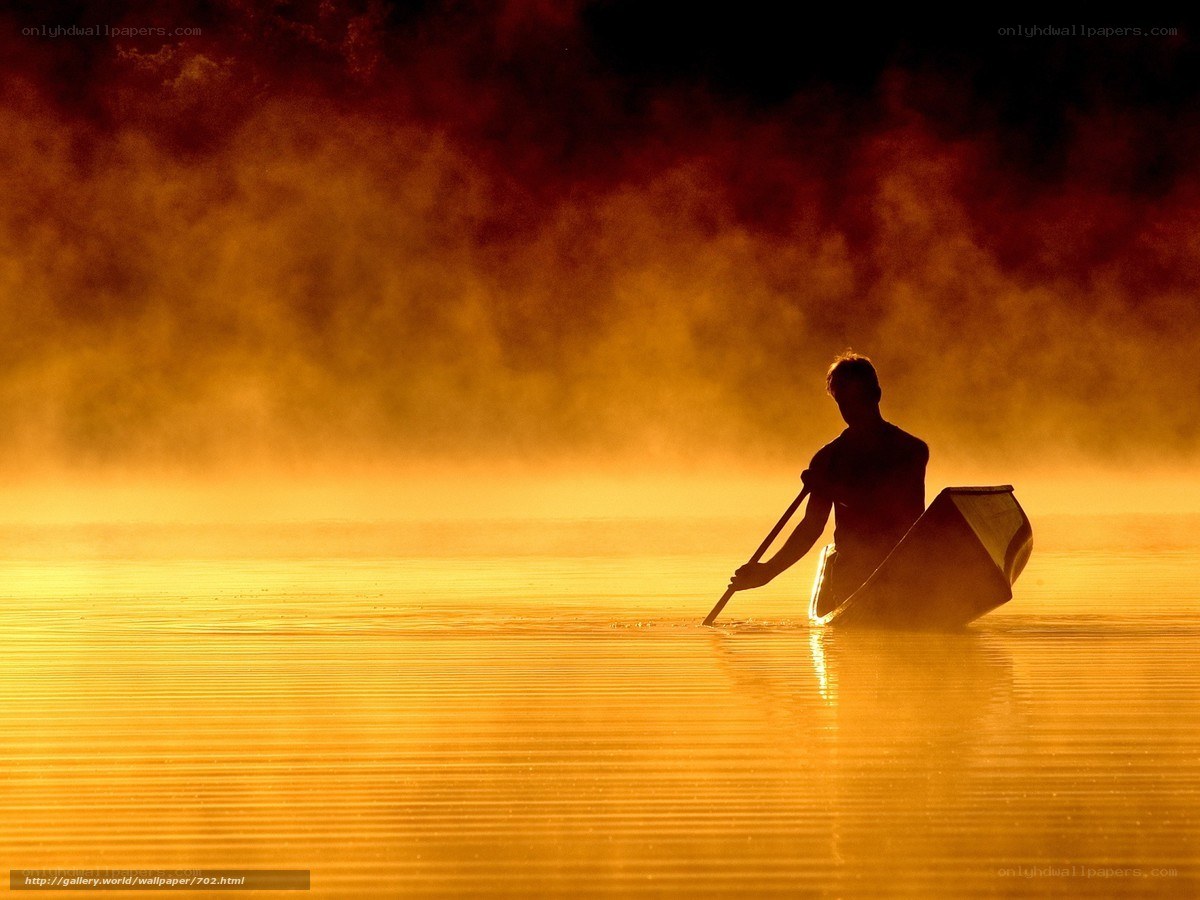 Silhouette of Canoeist at Dawn