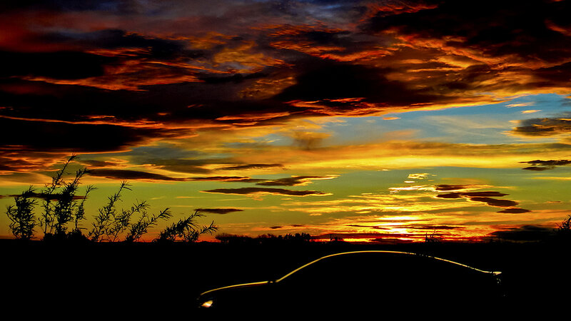 Silhouette of Car at Sunset