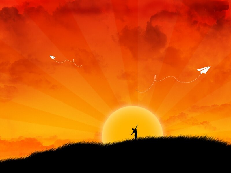 Silhouette of child flying paper planes